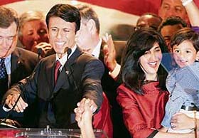 Louisianas Governor-elect Bobby Jindal, his wife Supriya and son Shaan Robert acknowledge supporters at the Republican party headquarters in Baton Rouge