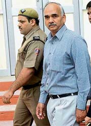 S.S. Rathi, former ACP of Crime Branch, Delhi Police, who has been convicted in the 1997 Connaught Place shooting case is brought to hear the verdict at the Patiala House Court in New Delhi