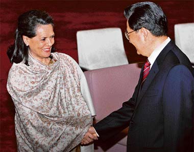 TIES WITH INDIA IMPORTANT, SAYS HU: Congress chief Sonia Gandhi is greeted by Chinese President Hu Jintao at the Great Hall of the People in Beijing on Friday. Hu said his country placed importance to friendly ties with India as reflected by the visit, the first by a foreign political party leader after the recent leadership changes in China. 
