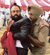 NRI groom Gurpreet Singh being arrested from Chahal Palace in Patiala on Friday.
