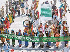 A human column of some of the country's poorest people demanding that the government 'give back their land' arrives in New Delhi on Sunday.