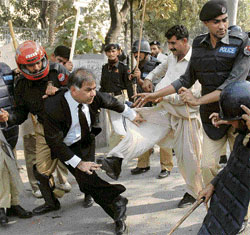 Policemen beat up a lawyer outside the High Court in Lahore on Monday.