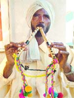 Kuldeep Singh playing “algoza”