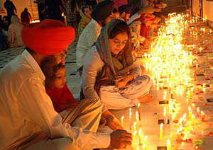 Residents light candles at Gurdwara Moti Bagh Sahib in Patiala on Friday.