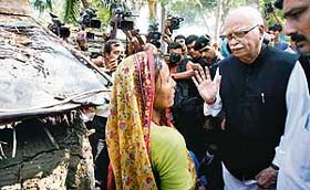 BJP leader L.K. Advani talks to a villager during his visit to Nandigram