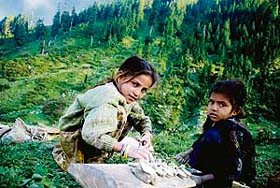Children of Gujjars play with clay at a foothill in the Bhaderwah district of J&K