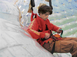 Strapping into the harness inside the zorb.