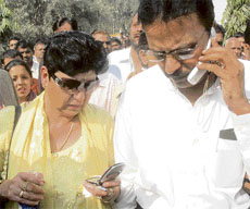 Neelam Krishnamurthy, president of Association of Victims of Uphaar, with her husband and other relatives of Uphaar tragedy victims, come out after the verdict of the case at Patiala Court in New Delhi on Tuesday.