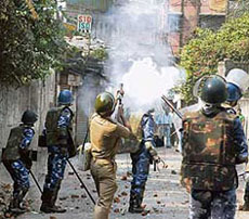 RAF personnel fire tear-gas shells on activists of the All-India Minority Forum, who were protesting against the violence in Nandigram and demanding cancellation of the visa of writer Taslima Nasreen, at Rippon Street in Kolkata on Wednesday.