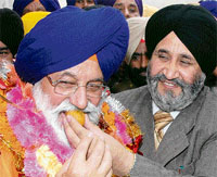 Avtar Singh is greeted by Daljeet Singh Cheema, adviser to the Chief Minister after his election in Amritsar on Friday.