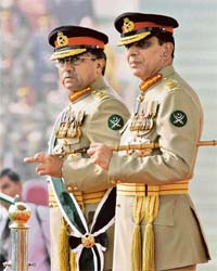 Pakistans newly-appointed army chief General Ashfaq Kiyani and President Pervez Musharraf stand after the change of command ceremony in Rawalpindi