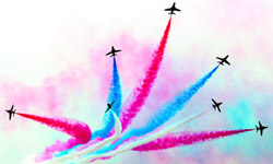Red Arrows, the British Royal Air Force Aerobic Team, paints the sky a beautiful crimson just outside Kuala Lumpur