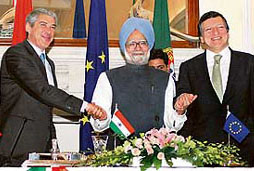 Portuguese Prime Minister Jose Socrates (left) Prime Minister Manmohan Singh and European Commission President Jose Manuel Barroso hold hands as they pose for media representatives at Hyderabad House in New Delhi on Friday. 