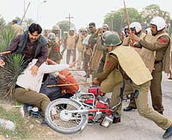 Policemen lathicharge supporters of Kuldeep Bishnoi in Karnal on Saturday.
