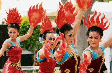 Demonstrators perform a dance to protest against deforestation outside the climate change conference in Nusa Dua, Bali Island, on Wednesday.