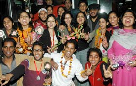 Students of the Apeejay College of Fine Arts who had won the north zone youth festival at Kanpur at Jalandhar railway station