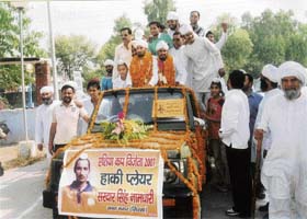 Sardar Singh, who was a member of the Indian hockey team that won the Asia Cup in Chennai this year, gets a warm welcome on his arrival in his home town, Sant Nagar in Sirsa
