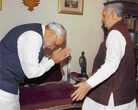 Gujarat Chief Minister Narendra Modi greets Governor Naval Kishor Sharma in Gandhinagar on Monday.