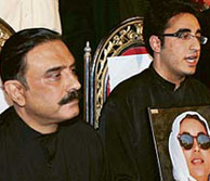 Newly appointed chairperson of the Pakistan Peoples Party Bilawal Bhutto Zardari (R), addresses a press conference in Nau Dero on Sunday as his father Asif Ali Zardari looks on.