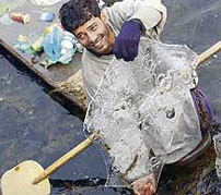 Boating on thin ice in Dal Lake on Tuesday.