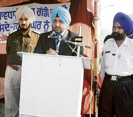 DSP (city) Bhupinder Singh addresses people on the first day of the road safety week in Jagraon on Tuesday.