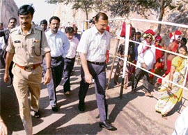 District collector Navin Mittal and commissioner C.V. Anand inspect the spot at Kanakdurga temple in Vijayawada where six pilgrims were killed in a stampede in the early hours of Thursday.