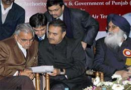 Minister of civil aviation Praful Patel with Haryana Chief Minister Bhupinder Singh Hooda before signing the MoU for the Mohali International Airport at a function at Punjab Bhavan in Chandigarh
