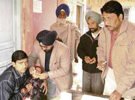 Dr K.C. Goel, DHO, Sangrur, inspects a pulse polio camp at Shree Ram Mandir Dharamsala at Ahmedgarh on Sunday.