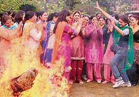 Students and faculty members of Guru Nanak Girls College celebrate Lohri in Ludhiana on Thursday.