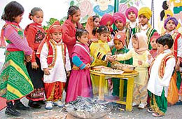 Tiny tots of Kiddies Paradise School celebrate Lohri with joy and fervour in Ludhiana on Thursday.