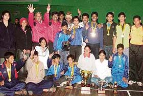 Winners flash the victory sign on the conclusion of the 53rd National School Games (Badminton) at Tau Devi Lal Sports Complex, Sector 3, Panchkula