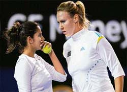 Oops! Sania Mirza appears intimidated as she speaks with Australian partner Alicia Molik during their womens doubles match against Israels Shahar Peer and Belarus Victoria Azarenka at the Australian Tennis Open tournament in Melbourne