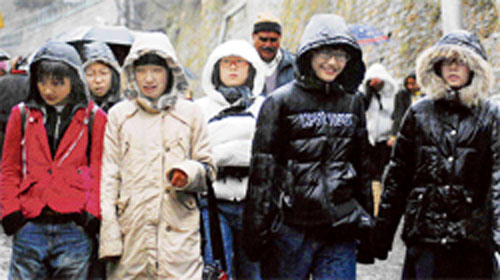 These kids enjoy a day out in the freezing cold in Shimla.