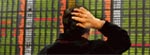 A South Korean scrutinises a stock index board.