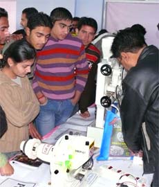 Students take a look at a model during the inter-school science exhibition competition at DAV College in Jalandhar