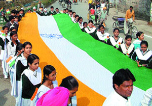 School students hold a 40-metre national flag at the Jallianwala Bagh during a march organised by the SC/ST cell of the Congress in Amritsar.