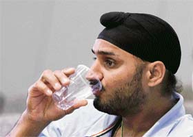 Harbhajan Singh drinks water before the start of his appeal hearing against a three-match ban imposed by the International Cricket Council at the Adelaide Federal Court in Australia