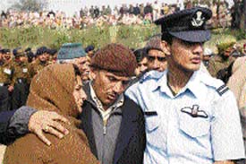 Lt-Col P.L. Chaudhary, father of Capt Sunil Kumar Chaudhary who died fighting insurgents in Assam, along with his younger son Flying Officer Ankur Chaudhary and wife at the cremation in Kathua on Tuesday.