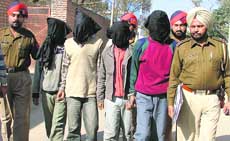 The robbers in police custody in Ludhiana on Friday.