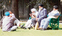 Senior citizens enjoy the sun at a park in Phase VII in Mohali