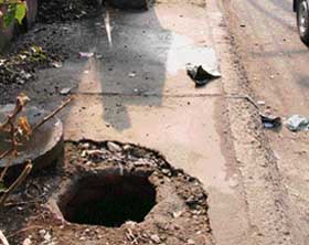 An open manhole poses a threat to passerby near Feroze Gandhi market in Ludhiana.