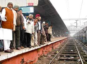 Chairman of the Passenger Services Committee of the Railway Board Parmeshwari Prashad Nirala (extreme left) points at the stinking tracks at the Amritsar railway station on Tuesday.