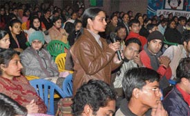 A student asks a question from a panel of experts during an inter-college sensitisation programme on female foeticide at MCM DAV College in Chandigarh on Wednesday.
