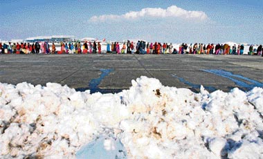 Stranded passengers from Jammu arriving at the Srinagar Airport after they were airlifted by the Indian Air Force on Saturday.
