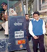 Maharashtra Navnirman Sena chief Raj Thackeray is escorted after his arrest at his residence in Mumbai on Wednesday.