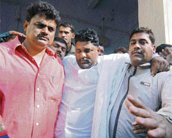 Rajesh Ranjan, alias Pappu Yadav (centre), is supported by co-defendants Rajan Tiwari (left) and Anil Yadav as he leaves a court hearing in Patna, where they were sentenced to life imprisonment for murder on Thursday.