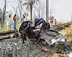 The remains of the auto-rickshaw that was hit by a train at Alipur village near Ropar on Saturday.