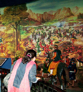 A curious onlooker engrossed in watching the battle scene depicted at the Maharaja Ranjit Singh Panorama in Amritsar on Friday.