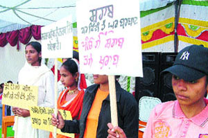 Students of Government Senior Secondary School hold placards displaying slogans against the menace of drugs and liquor during their annual function at Talwandi Dasundha Singh, near Amritsar, on Tuesday.
