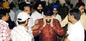 Grieving relatives of Kirpal Singh outside Krishna Charitable Hospital in Model Town, Ludhiana, on Sunday.